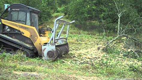 clearing small trees with skid steer|skid steer clearance.